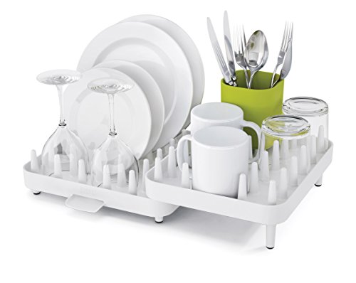égouttoir à vaisselle en plastique solide blanc de taille ajustable, signé Joseph Joseph avec picots